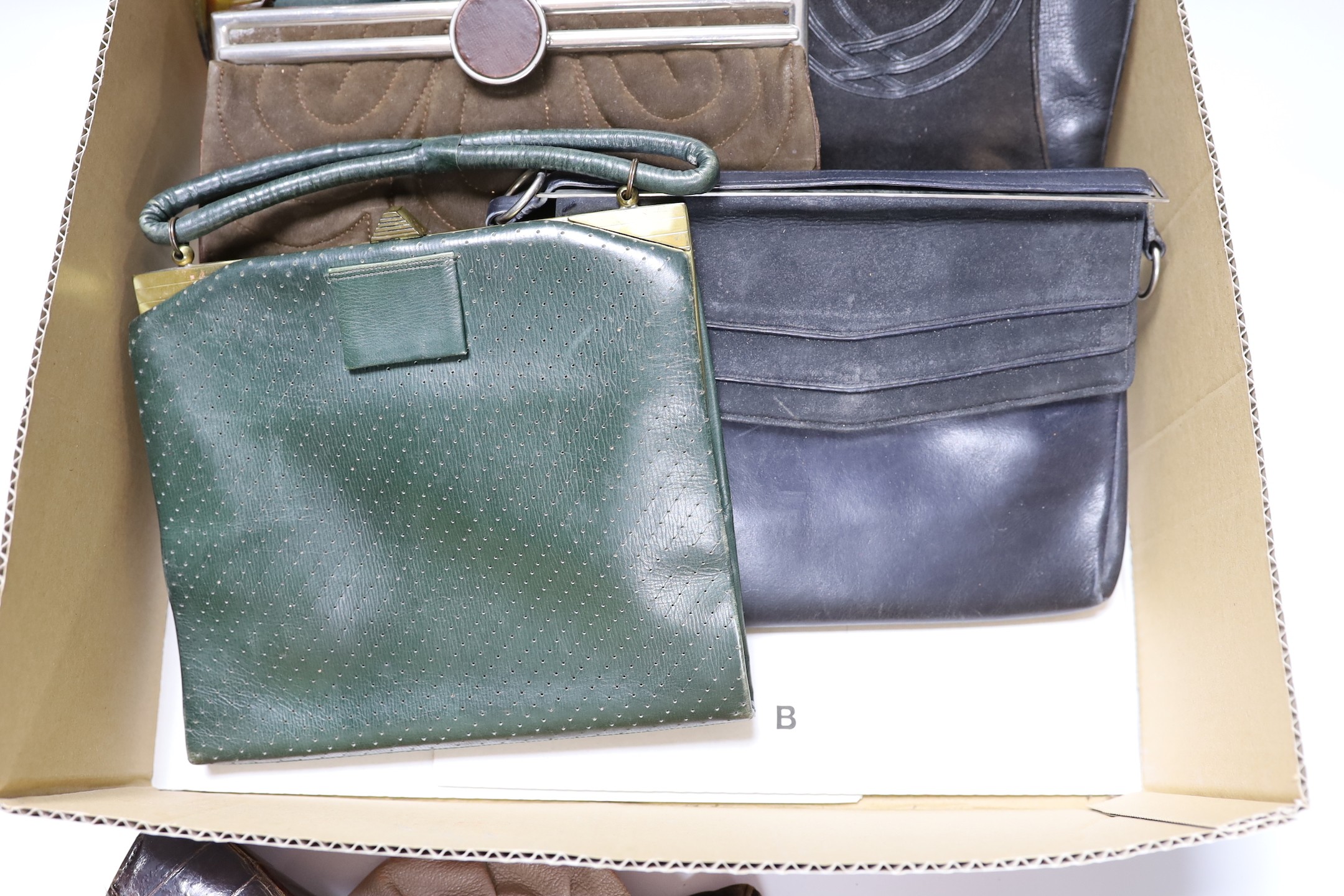 A collection of nine 1930's and 1940's leather, suede and crocodile ladies handbags with unusual metal clasps and frames